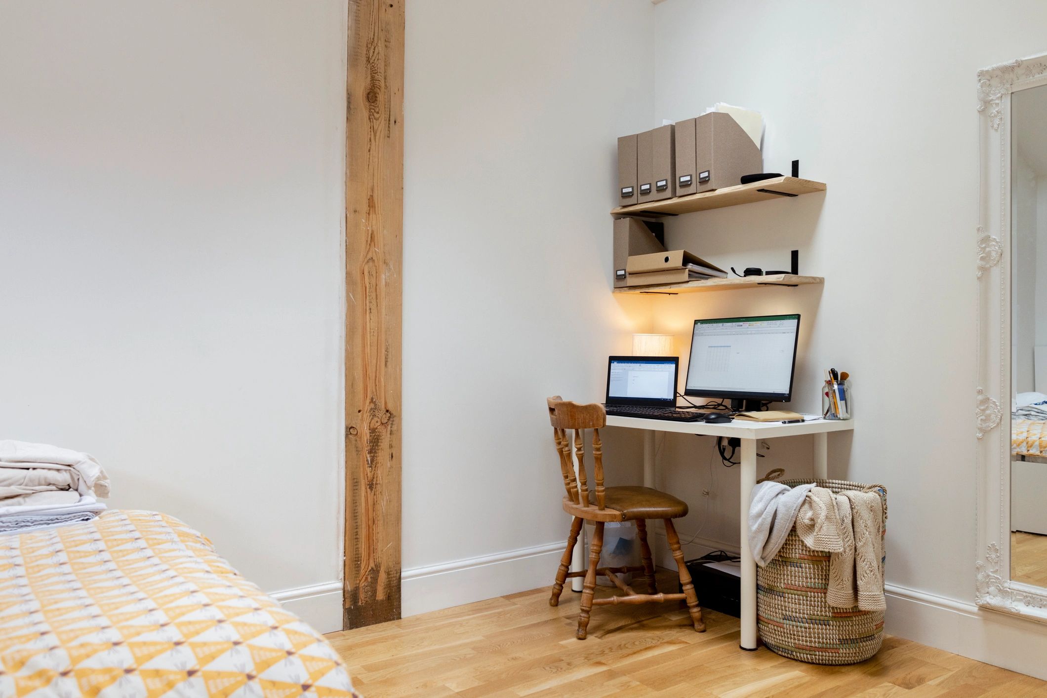 Editorial workspace with shelves and desk