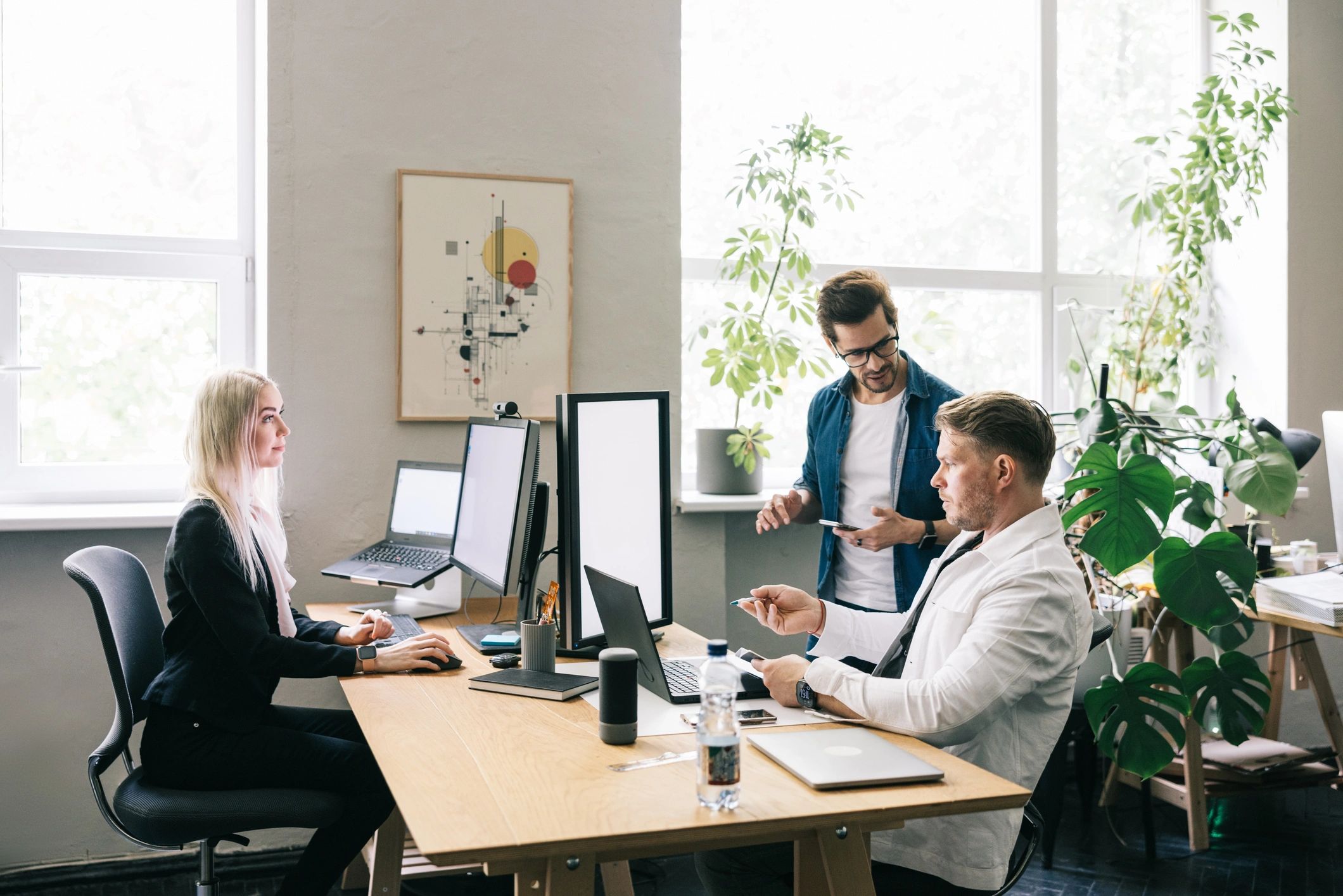 Creative editorial team collaborating in a bright workspace